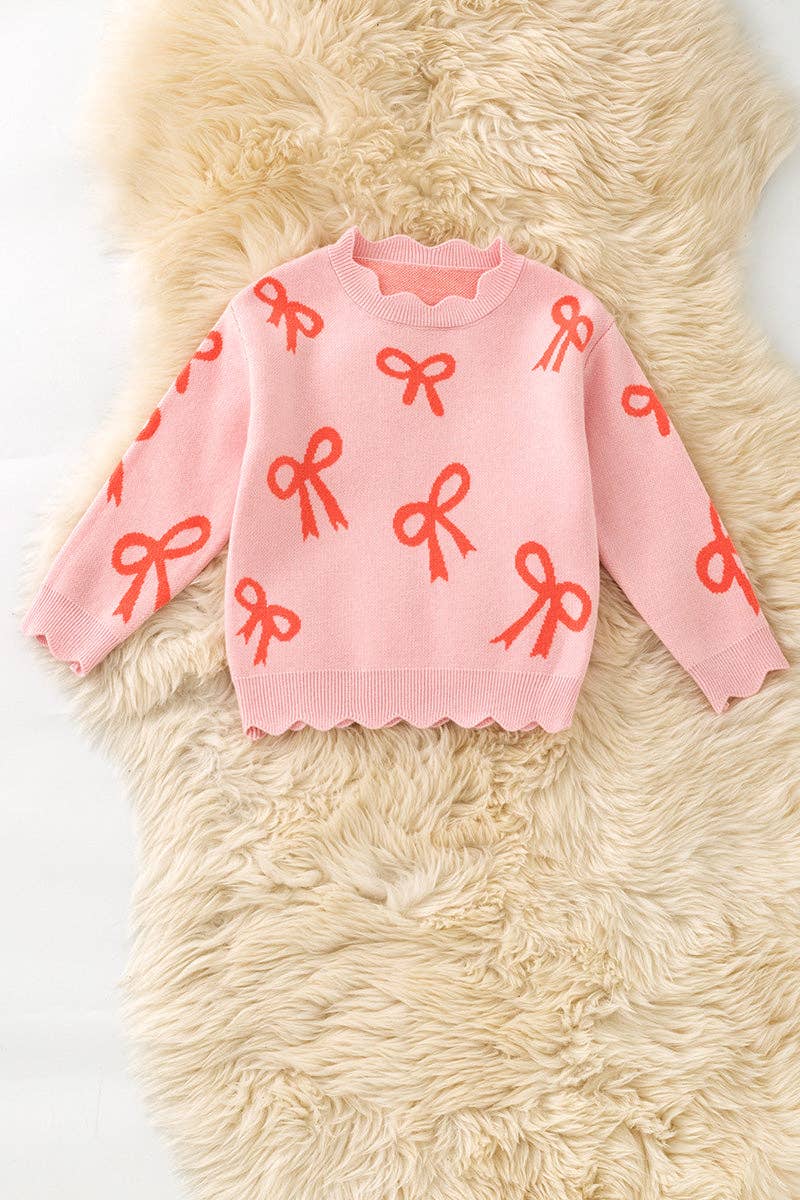 Coral bow on pink pullover knit sweater w/ scalloped hem. TPG60463 AMY