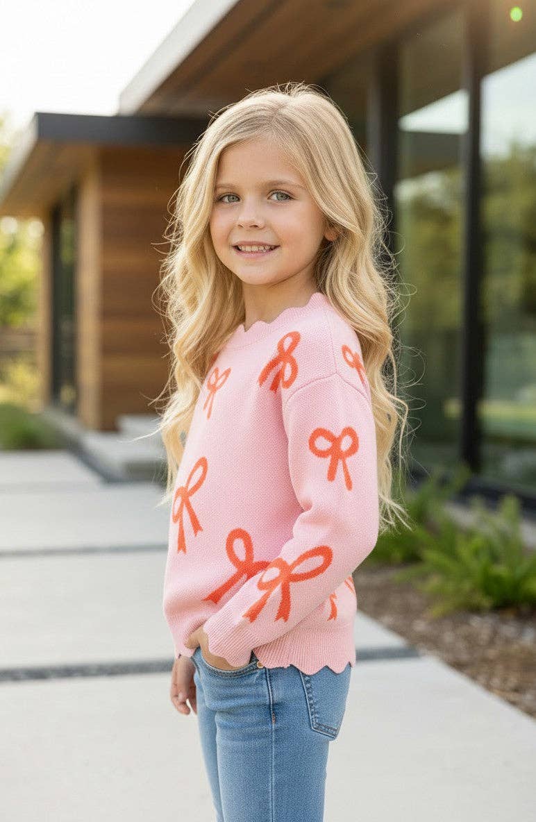 Coral bow on pink pullover knit sweater w/ scalloped hem. TPG60463 AMY