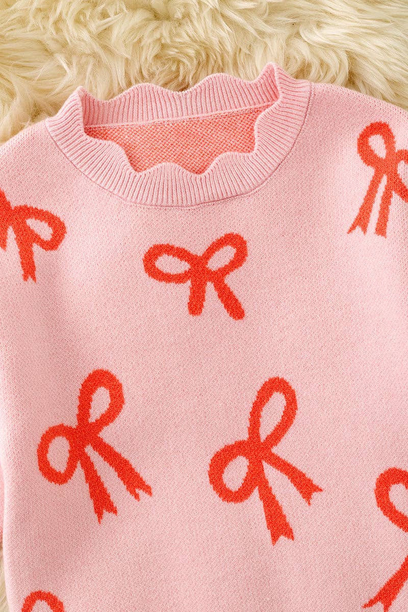 Coral bow on pink pullover knit sweater w/ scalloped hem. TPG60463 AMY