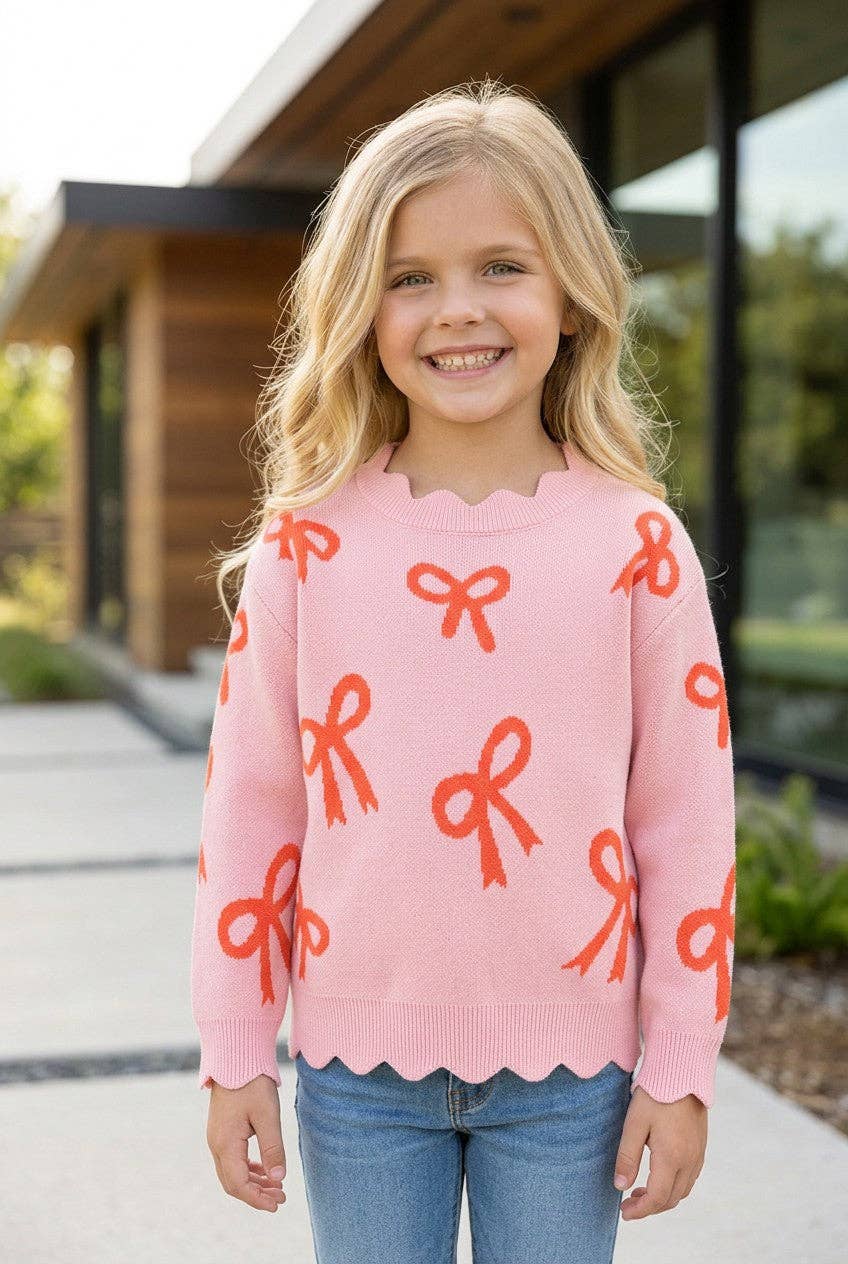 Coral bow on pink pullover knit sweater w/ scalloped hem. TPG60463 AMY