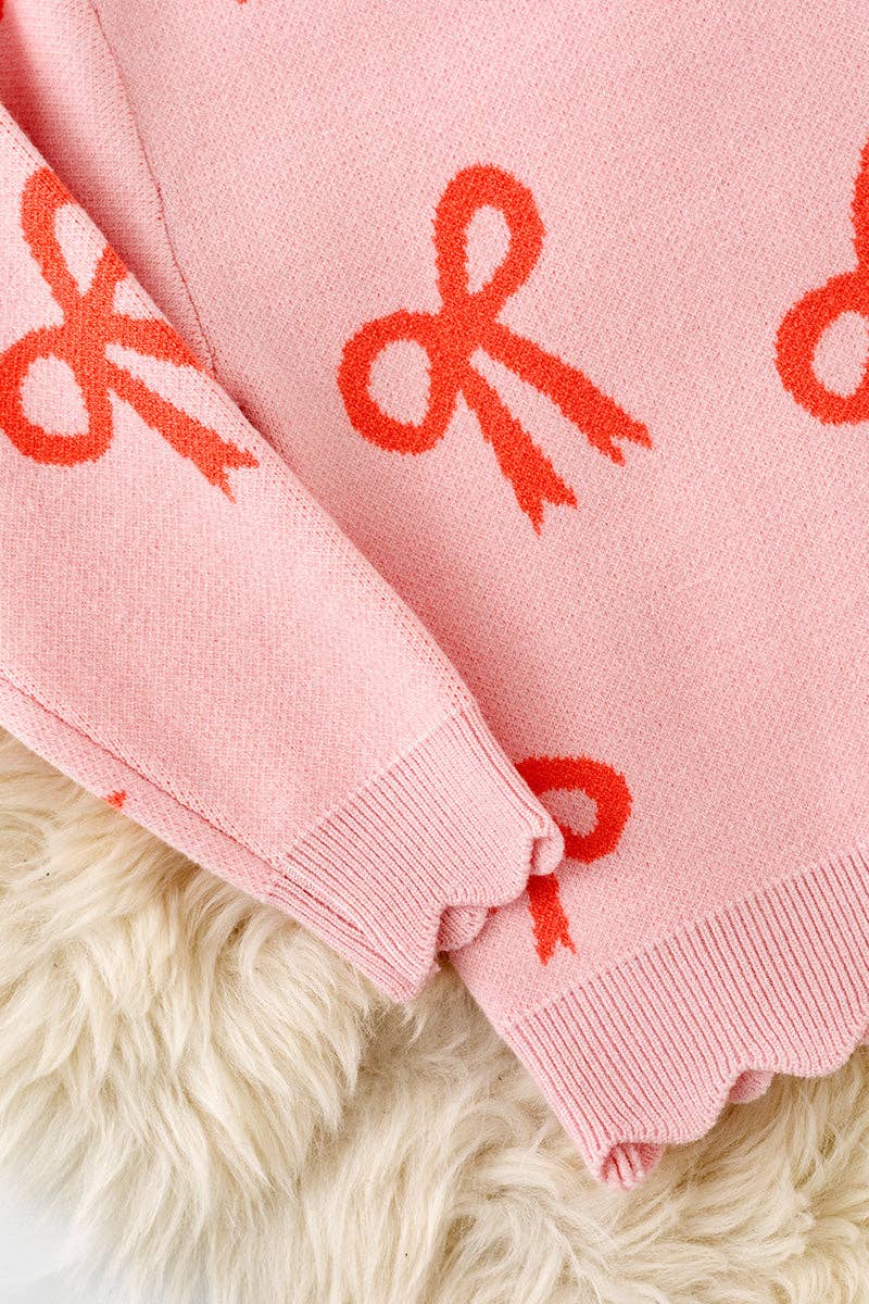 Coral bow on pink pullover knit sweater w/ scalloped hem. TPG60463 AMY